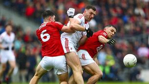 <p>Cork's Rory Maguire and Sean Powter in action against Louth's Sam Mulroy in the All-Ireland SFC Qualifier at Páirc Uí Chaoimh this afternoon</p>