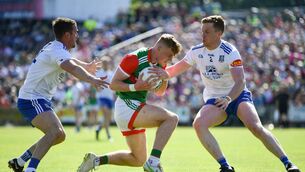 <p>4 June 2022; Jack Carney of Mayo in action against Monaghan players Ryan Wylie, left, and Kieran Duffy during the GAA Football All-Ireland Senior Championship Round 1 match between Mayo and Monaghan at Hastings Insurance MacHale Park in Castlebar, Mayo. Photo by Piaras Ó Mídheach/Sportsfile</p>