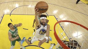 <p>UP THERE: Golden State Warriors guard Klay Thompson (11) drives against the Boston Celtics in Game 2 of basketball's NBA Finals in San Francisco</p>