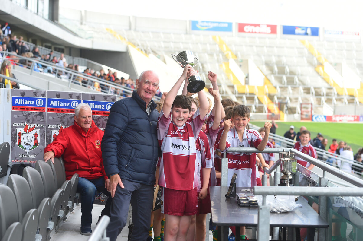 Liam Shanahan makes the cup presentation to captain, Ruairi O'Conchuir after Gaelscoil Ui Eigearthaigh, Cobh's victory over St Mary's on the Hill, Knocknaheeny.