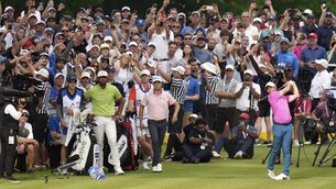 <p>The centre of attention: Rory McIlroy tees off on the 16th hole as Justin Thomas, center, and Tony Finau, left, look on during the final round of the Canadian Open golf tournament in Toronto on Sunday. Pic: Nathan Denette/The Canadian Press via AP</p>