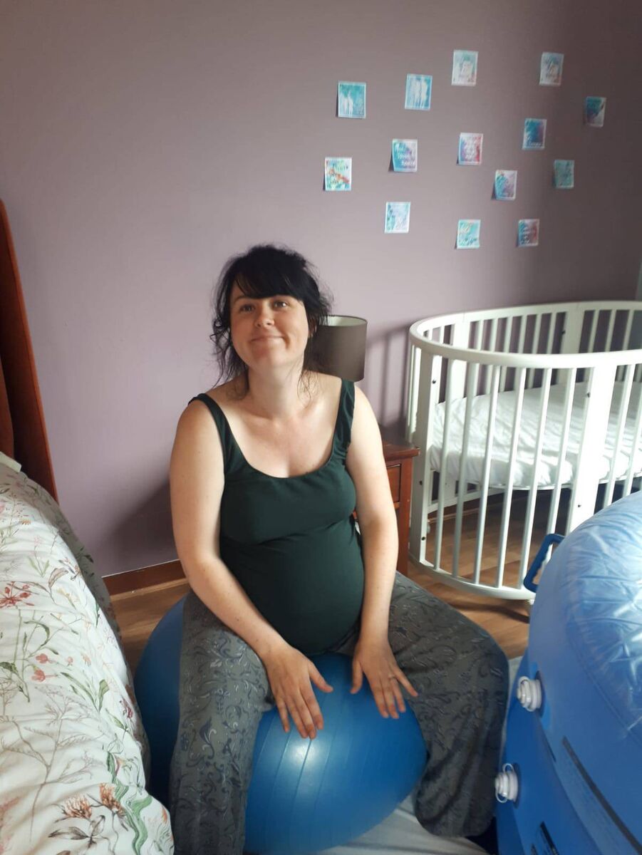 Aisling Ui Dhalaigh using a birthing ball next to the pool. She finds it hard to pick out any one thing which made her homebirth perfect.