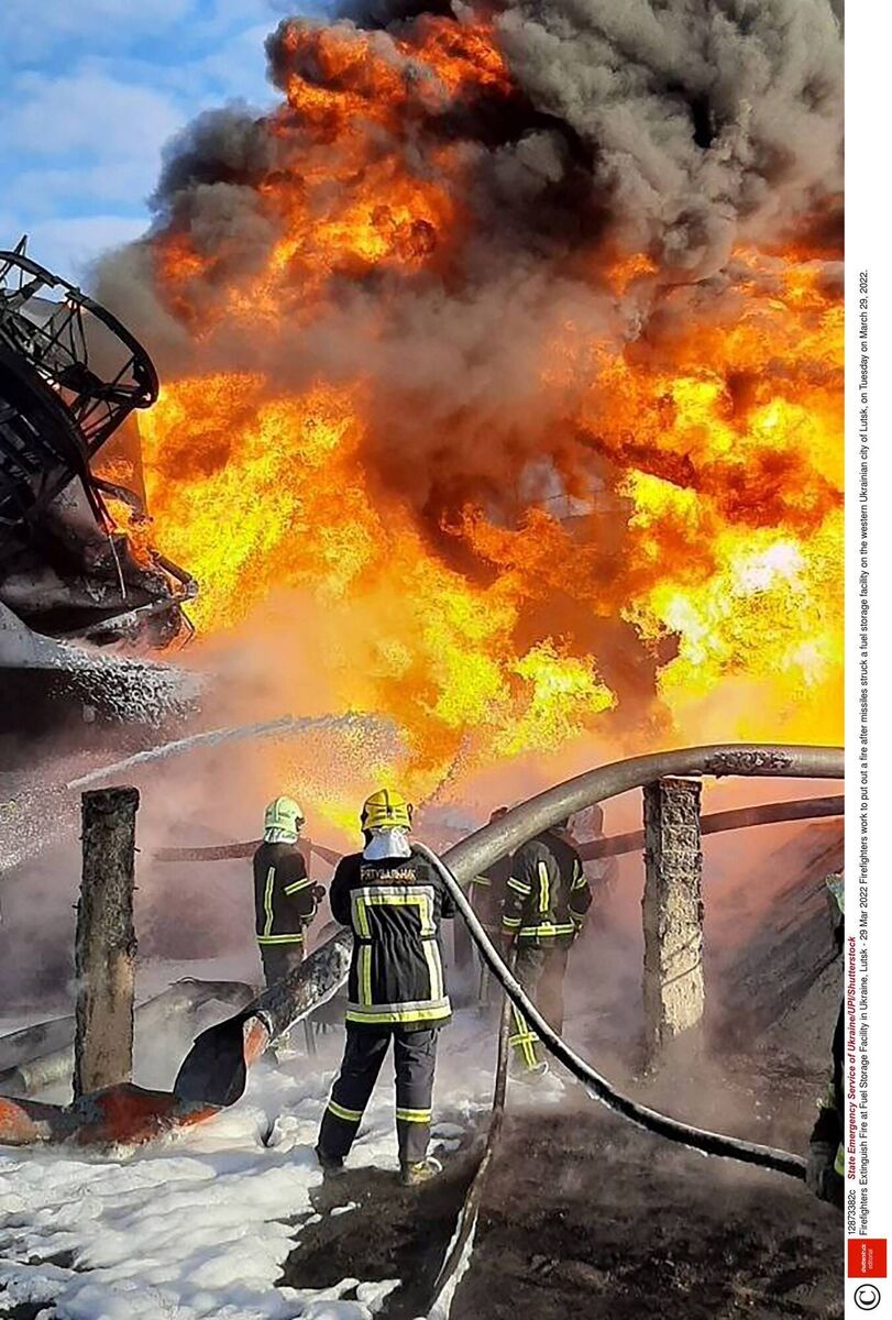Firefighters put out a fire after missiles struck a fuel storage facility in Lutsk last March. Photo by State Emergency Service of Ukraine/UPI/Shutterstock