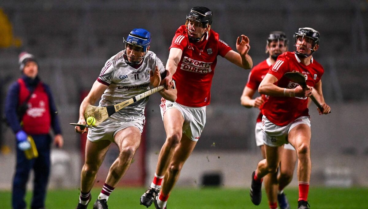 Conor Cooney of Galway in action against Robert Downey of Cork during the Allianz Hurling League