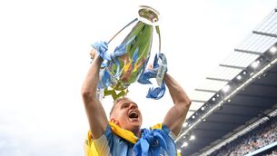 <p>MANCHESTER, ENGLAND - MAY 22: Oleksandr Zinchenko of Manchester City celebrates with the Premier League trophy and a Ukrainian flag after their side finished the season as Premier League champions during the Premier League match between Manchester City and Aston Villa at Etihad Stadium on May 22, 2022 in Manchester, England. (Photo by Michael Regan/Getty Images)</p>