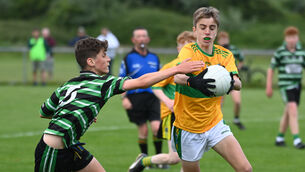 <p> 13th June 2022. Glanmire's Adam Naughton is tackled by Douglas' Ian Butler during the Rebel Og under 14 Premier 1A FC final at St Michaels GAA. Picture; Eddie O'Hare</p>
