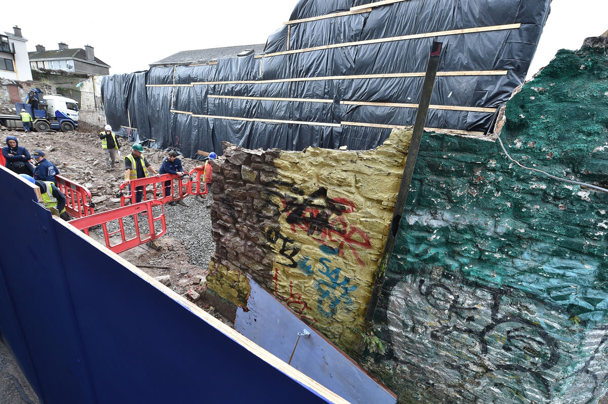  Garda members on duty on the site of the former Nancy Spain's pub on Barrack Street, Cork, where the human remains were discovered. Picture: Dan Linehan