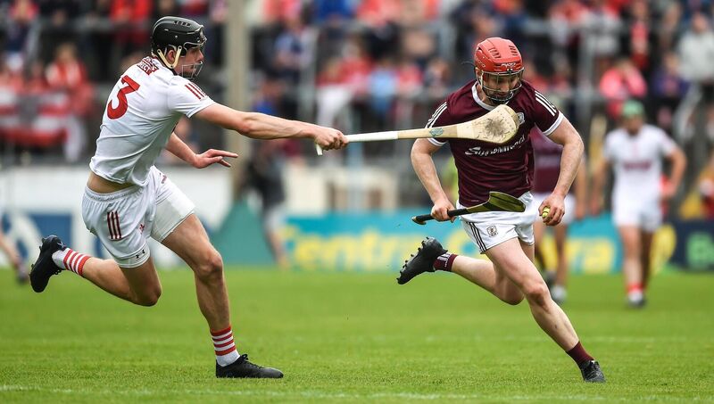 Out of reach: Tom Monaghan of Galway in action against Robert Downey of Cork during the GAA Hurling All-Ireland Senior Championship Quarter-Final match between Galway and Cork at the FBD Semple Stadium in Thurles, Tipperary. Pic: Daire Brennan/Sportsfile