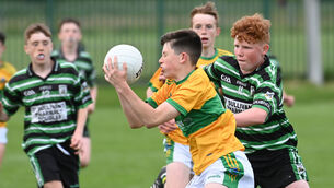 <p> 13th June 2022. Glanmire's Tom O'Flynn wins the ball from Douglas' Ciaran Fitzgerald during the Rebel Og under 14 Premier 1A FC final at St Michaels GAA. Picture; Eddie O'Hare</p>
