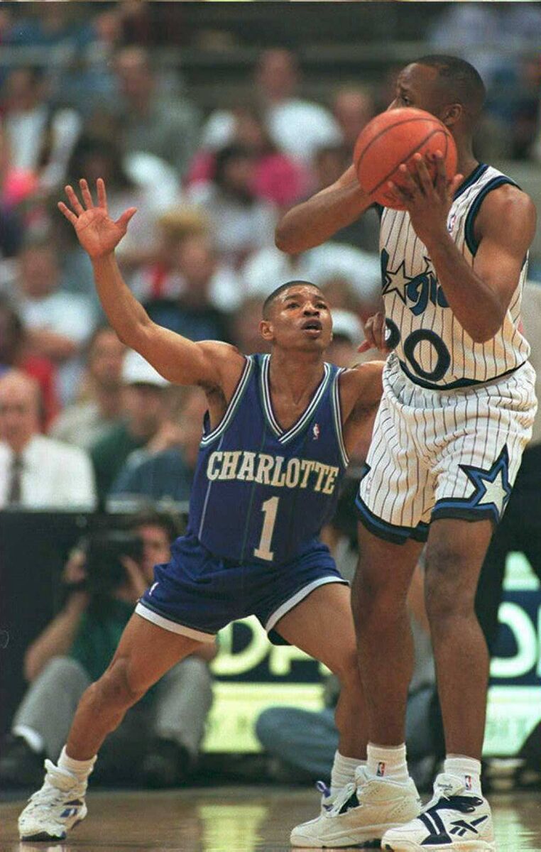 Bogues shadows Orlando's Brian Shaw. Bogues shadows Orlando's Brian Shaw.
