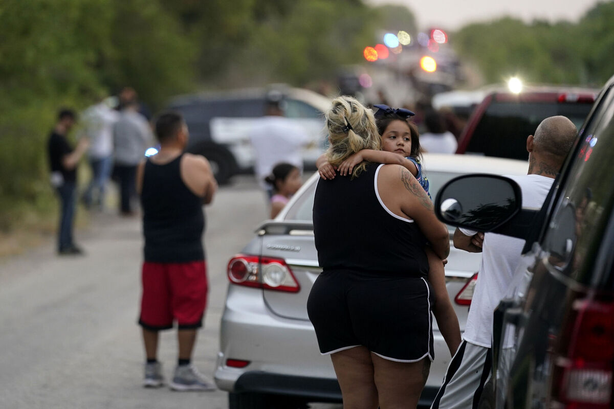 Onlookers stand near the scene where a semitrailer with multiple dead bodies was discovered, Monday, June 27, 2022, in San Antonio. Pciture: AP Photo/Eric Gay Onlookers stand near the scene where a semitrailer with multiple dead bodies was discovered, Monday, June 27, 2022, in San Antonio. Pciture: AP Photo/Eric Gay