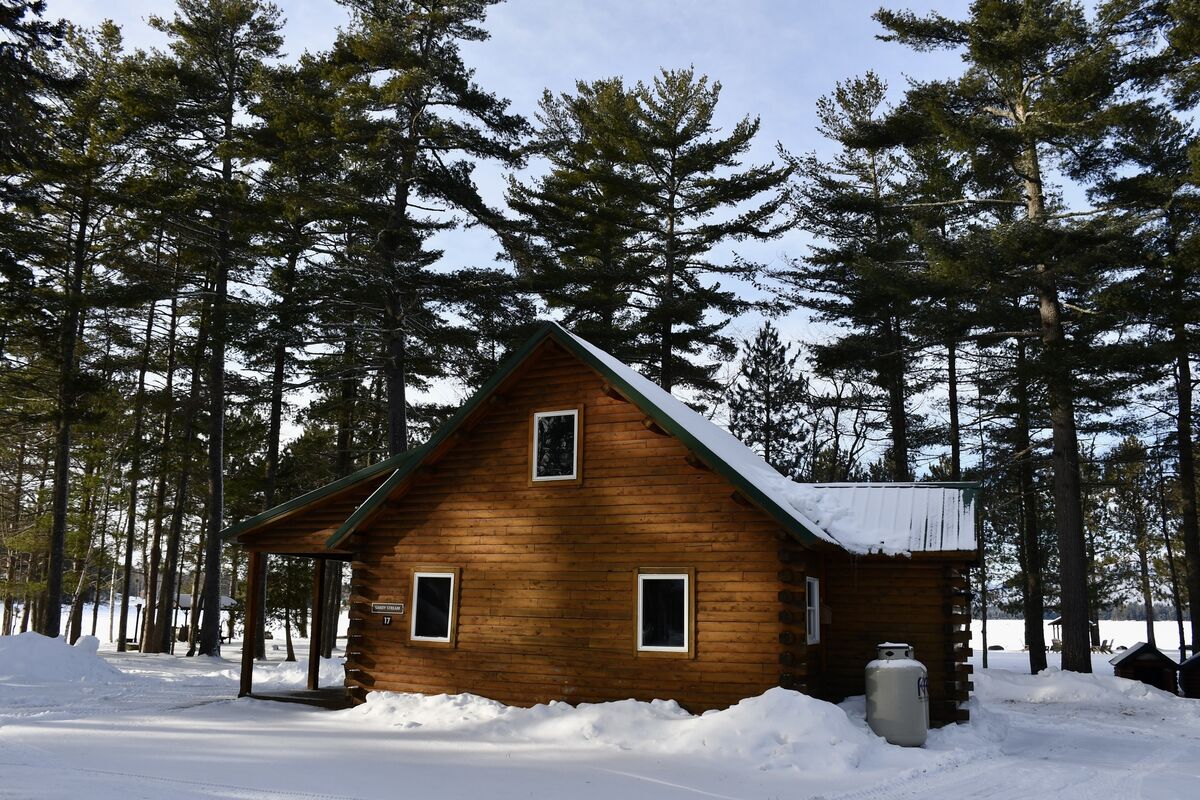 Snow-laden cabins in Maine