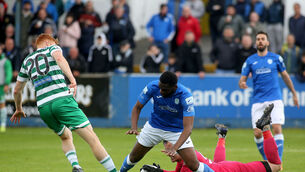 <p>SMOTHERED: Finn Harps' Gavin Mulreany saves at the feet of Shamrock Rovers' Rory Gaffney. Pic: ©INPHO/Lorcan Doherty</p>