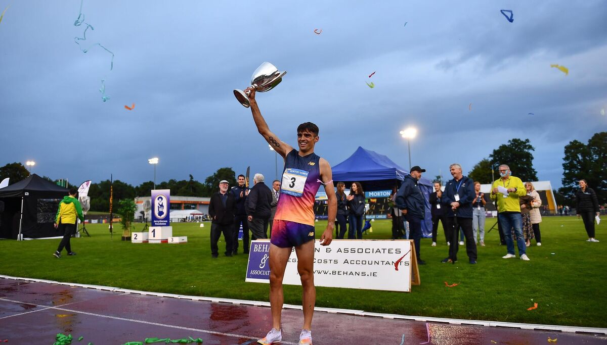 2 July 2022; Andrew Coscoran of Star of the Sea AC celebrates with the cup after winning the Morton Mile during the 2022 Morton Games at Morton Stadium in Santry, Dublin. Photo by David Fitzgerald/Sportsfile