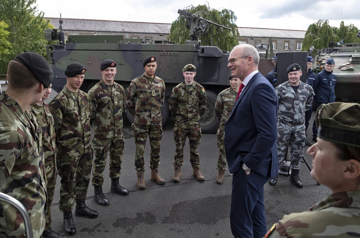 The Minister for Defence, Mr. Simon Coveney T.D., pictured with members of the Defence Forces 