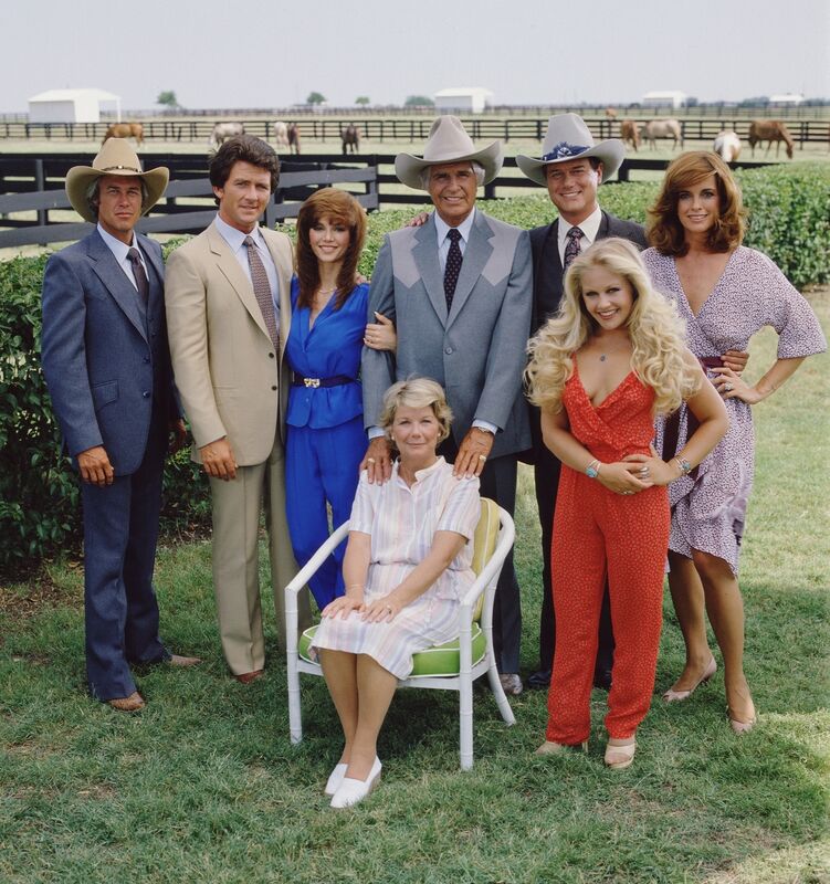 Dallas: From left, Steve Kanaly (as Ray Krebbs), Patrick Duffy (as Bobby Ewing), Victoria Principal (as Pamels Barnes Ewing), (sitting), Barbara Bel Geddes (as Eleanor Southworth 'Miss Ellie' Ewing), Jim Davis (1909 - 1981) (as John Ross 'Jock' Ewing), Larry Hagman (as John Ross 'J.R.' Ewing, Jr.), Charlene Tilton (as Lucy Ewing) (in red), and Linda Gray (as Sue Ellen Ewing)