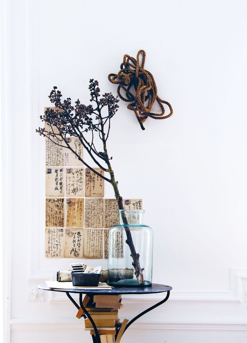 A foraged branch adds texture, height and a sculptural effect to a side table. A foraged branch adds texture, height and a sculptural effect to a side table.
