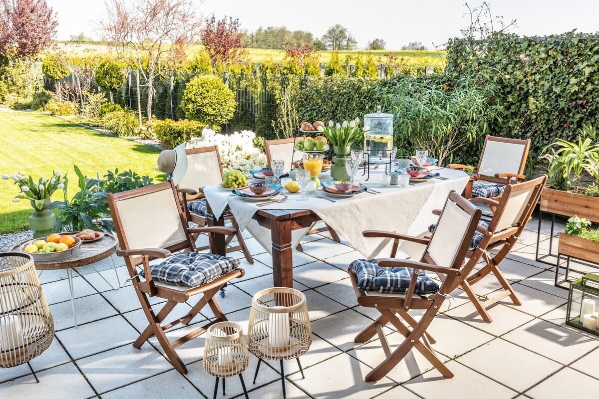 Invest in a simple bistro set or a four-chair set-up to sip a lemonade on the deck or patio. This arrangement is a generic, affordable style in easy care hardwood, here supplied by dekoira.de, above. Invest in a simple bistro set or a four-chair set-up to sip a lemonade on the deck or patio. This arrangement is a generic, affordable style in easy care hardwood, here supplied by dekoira.de, above.