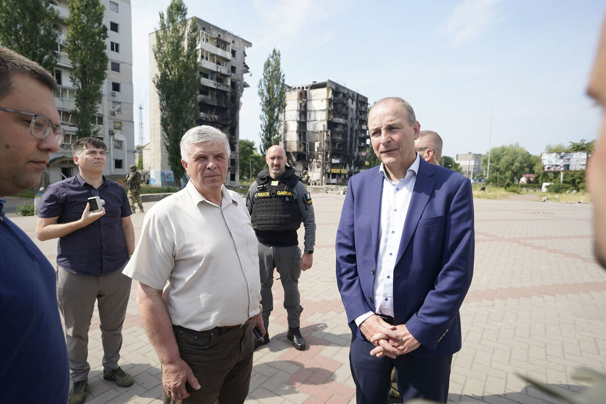 Micheál Martin with local officials and members of the Irish Emergency Response Unit. Picture: Niall Carson/PA Wire