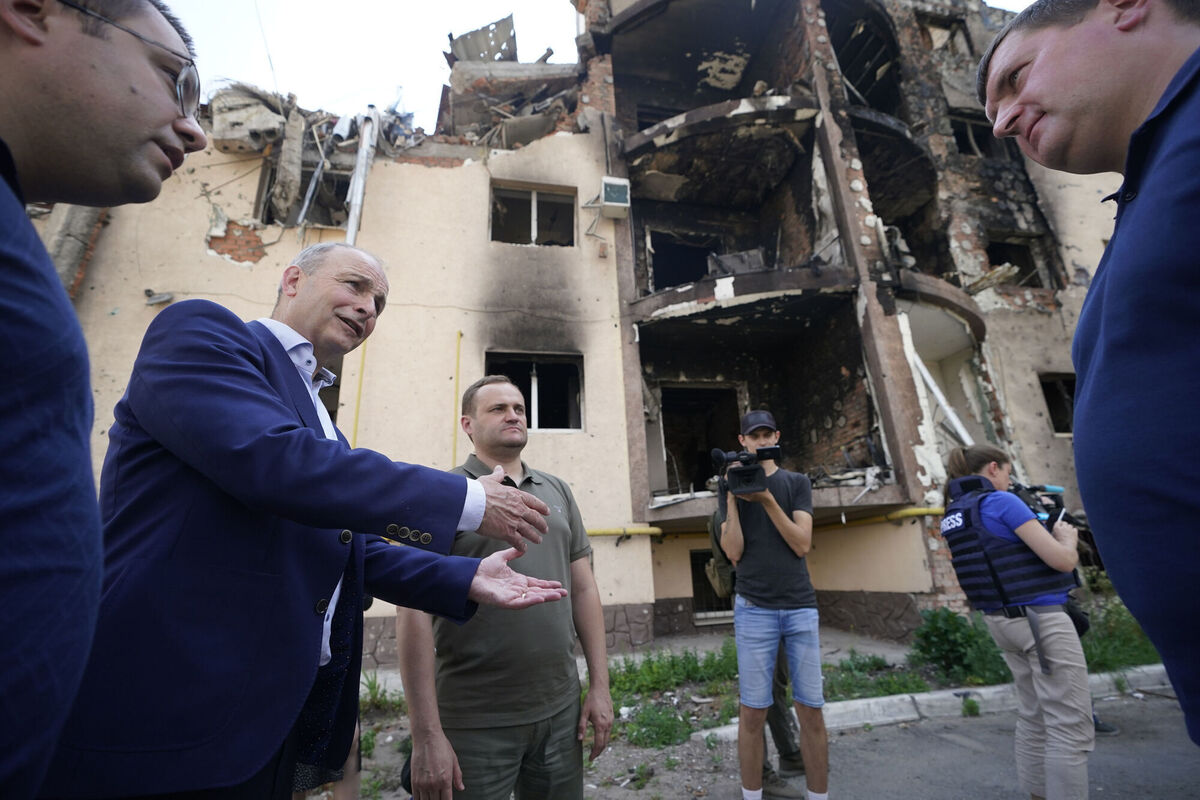 Taoiseach Micheal Martin speaks with local officials whilst viewing the damage to the city of Irpin, Ukraine. Picture: Niall Carson/PA Wire