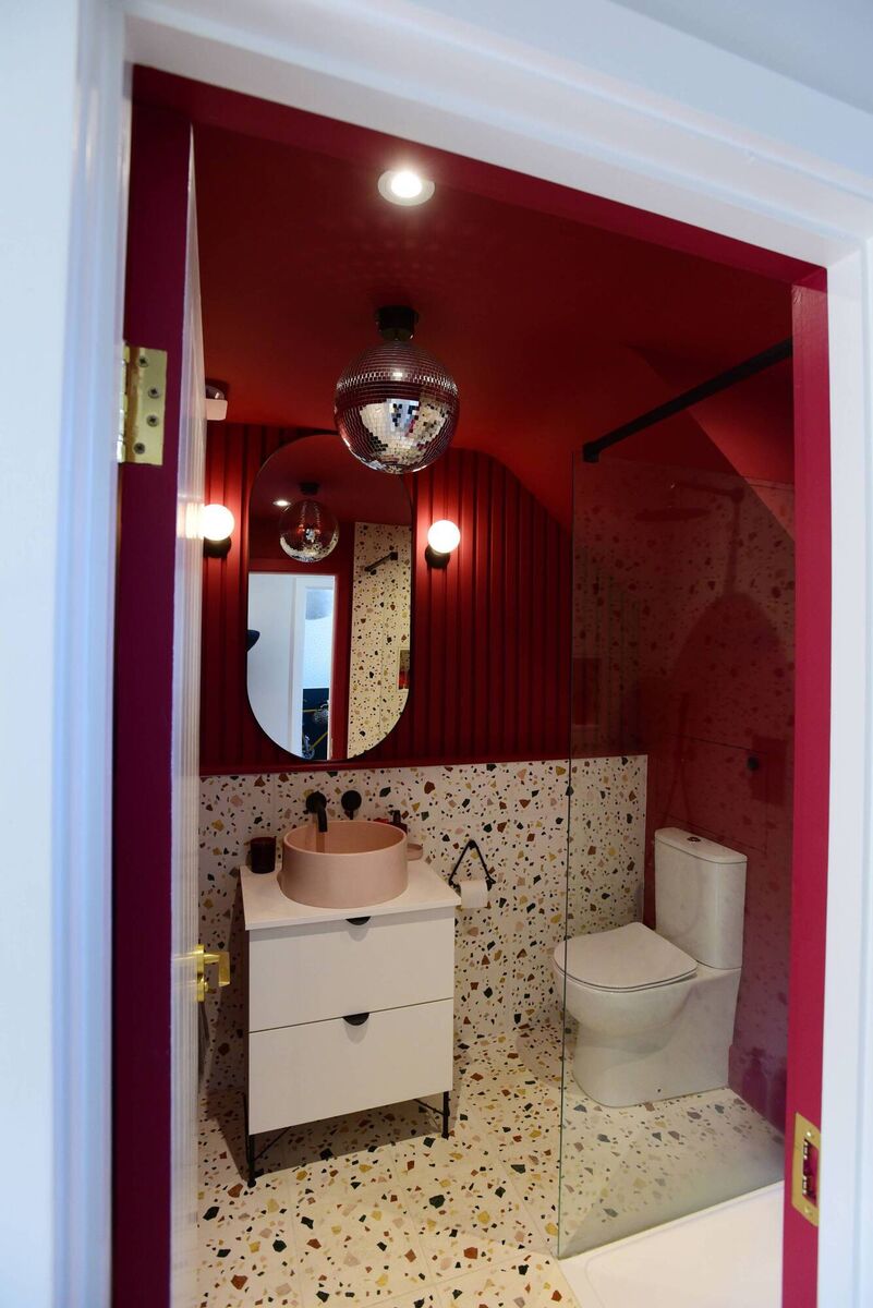  The downstairs bathroom complete with a glitterball overhead light in Jennifer's house. Picture: Moya Nolan