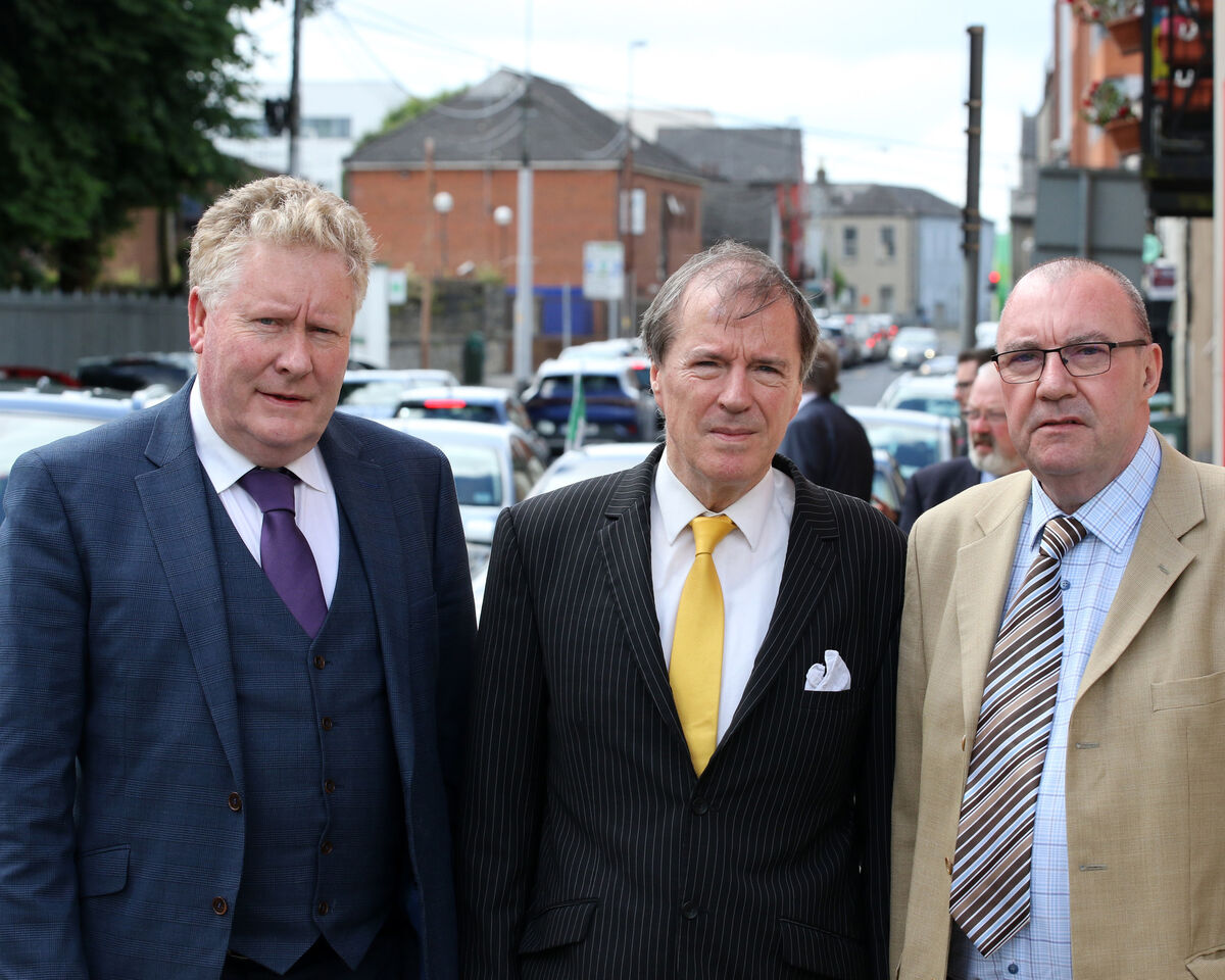 Fine Gael councillors Tom Ruddle and Gerald Mitchell, with Fianna Fáil councillor Francis Foley, at the funeral of Jerry O'Dea. Picture: Brendan Gleeson