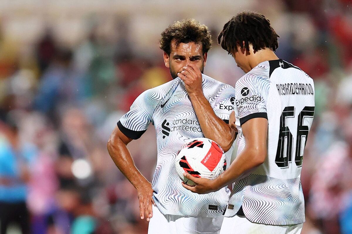 DEEP IN CONVERSATION: Mohamed Salah and Trent Alexander-Arnold of Liverpool speak. Pic: Pakawich Damrongkiattisak/Getty Images