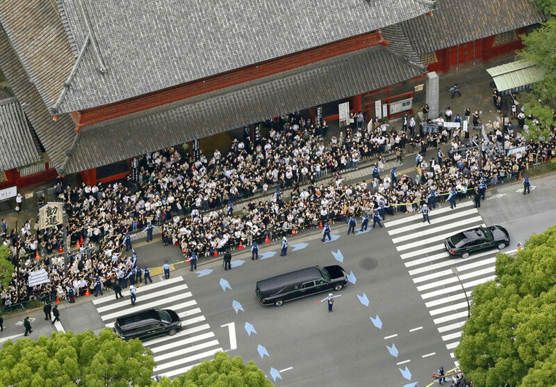 The hearse carrying Shinzo Abe leaves Zojoji temple after his funeral in Tokyo on July 12. Picture: Kyodo News via AP The hearse carrying Shinzo Abe leaves Zojoji temple after his funeral in Tokyo on July 12. Picture: Kyodo News via AP