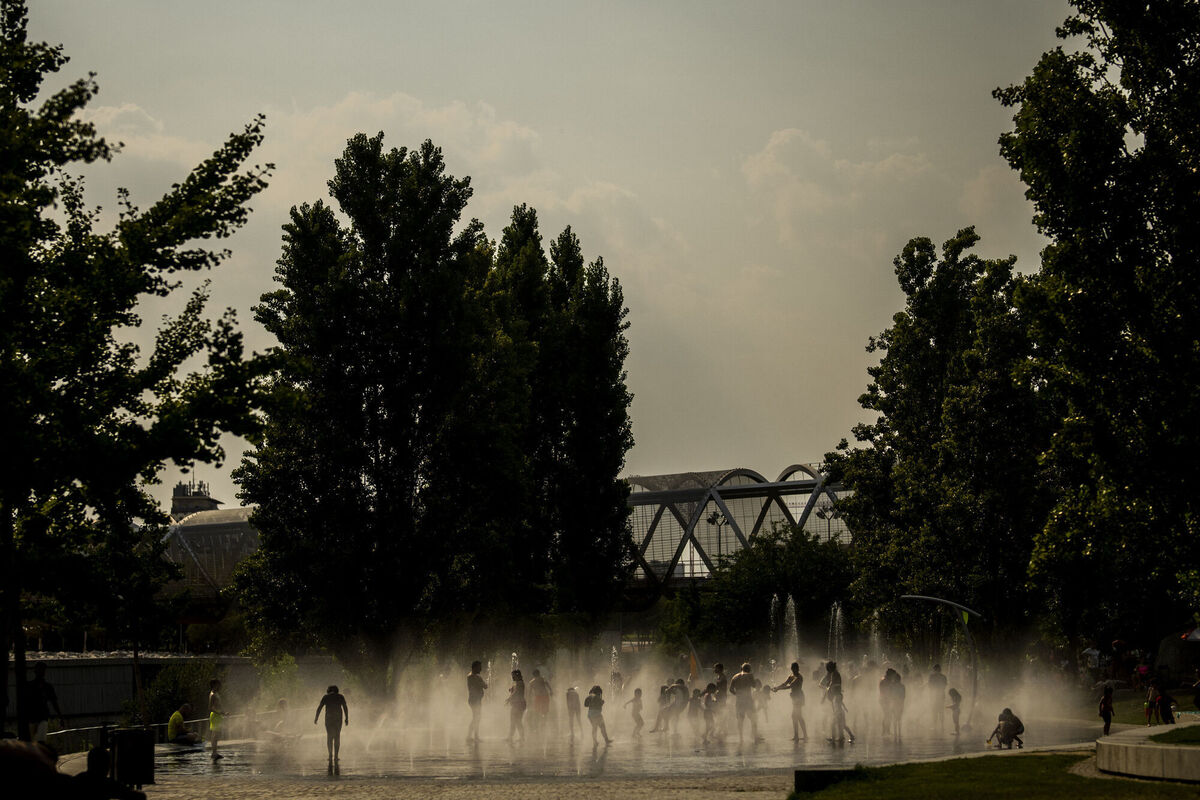 People cool off in an urban beach at Madrid Rio park in Madrid. Weather forecasters say Spain is expected to have its second heat wave in less than a month and that it will will last at least until the weekend. Picture: AP Photo/Manu Fernandez