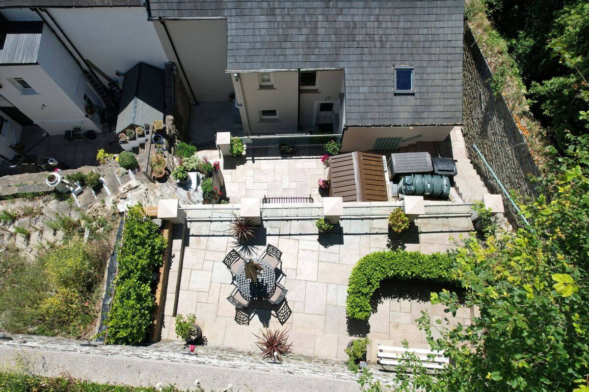 Stepped terraces to the rear make the most of the sunshine and views