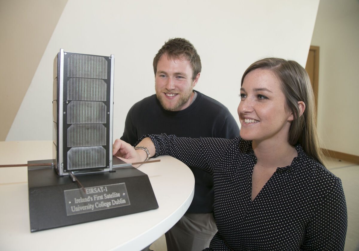 Pictured in March 2019 at UCD with a model of the EIRSAT-1 satellite Joe Thompson, PhD student, UCD School of Mechanical and Materials Engineering and Maeve Doyle, PhD student, UCD School of Physics Research and Development. Picture: Colm Mahady / Fennells