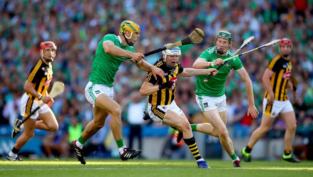 FAMILIAR FOES: Limerick’s Dan Morrissey and William O'Donoghue with TJ Reid of Kilkenny. ©INPHO/James Crombie
