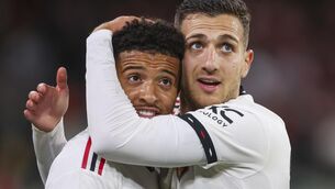 <p>HOWZAT? Manchester United's Jadon Sancho, left, is congratulated by teammate Diogo Dalot after scoring his team's third goal at the Melbourne Cricket Ground. </p>