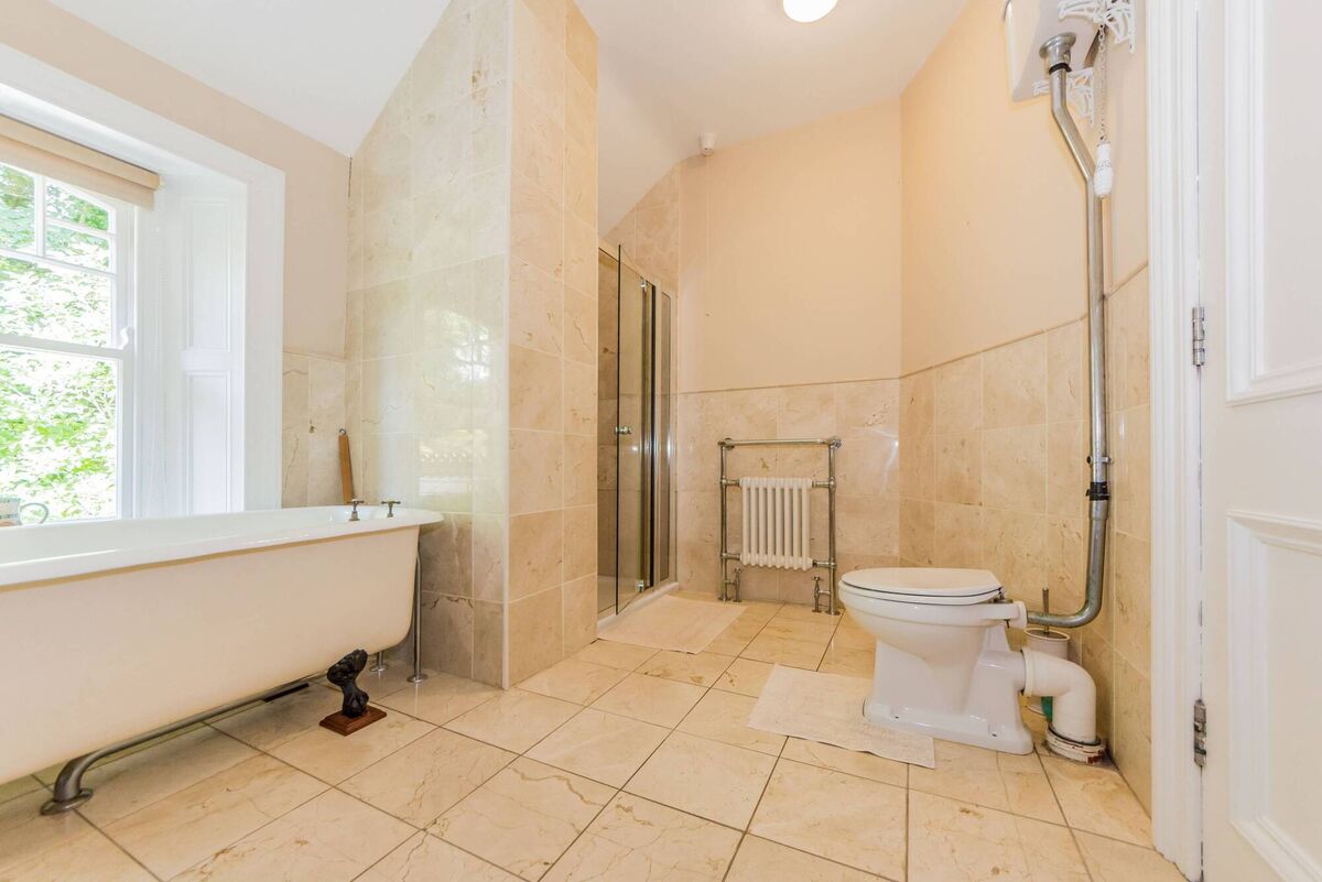 Main bathroom with immaculate cast-iron, roll-top bath and separate shower Main bathroom with immaculate cast-iron, roll-top bath and separate shower