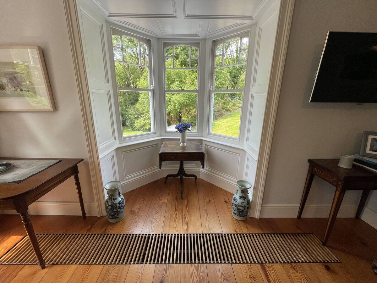 Vented warm air heating in main reception rooms, with pitch pine floors Vented warm air heating in main reception rooms, with pitch pine floors