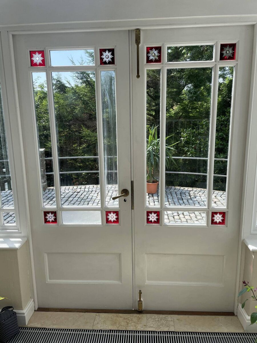 Etched colored glass in double doors Etched colored glass in double doors