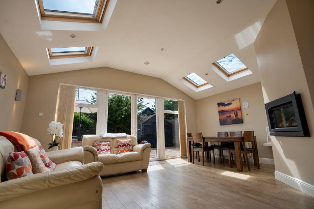 The home's living room has timber flooring and a fireplace.