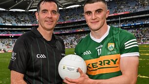 <p>24 July 2022; Referee Seán Hurson presents the match ball to Seán O'Shea of Kerry after the GAA Football All-Ireland Senior Championship Final match between Kerry and Galway at Croke Park in Dublin. Photo by Ramsey Cardy/Sportsfile</p>