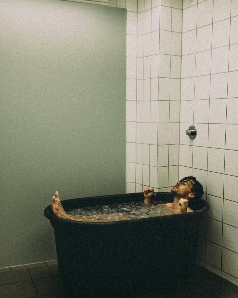 Harry Styles takes an ice-bath while on tour in Cologne, Germany 