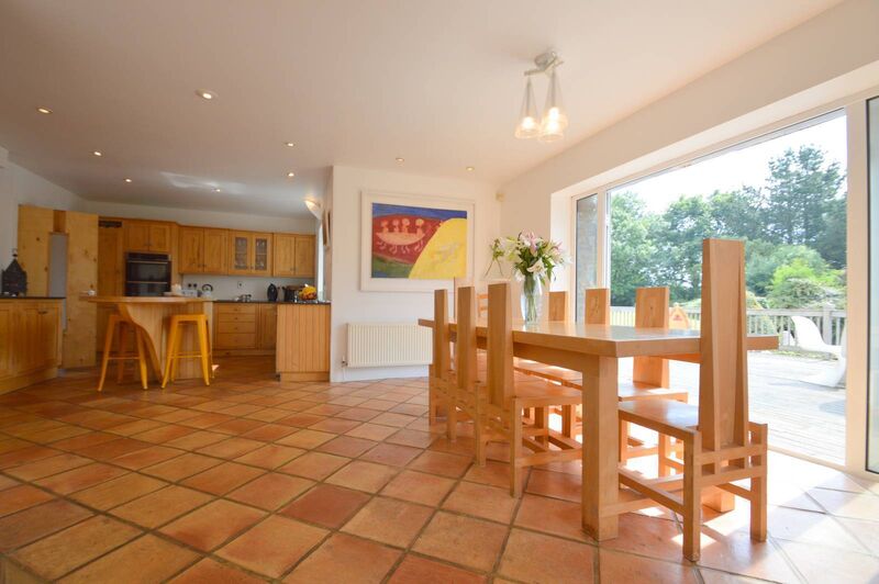 Warm terracotta tiles and 'Homegrown' table and chairs, which can be sold with the house Warm terracotta tiles and 'Homegrown' table and chairs, which can be sold with the house