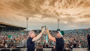 <p>HEROES: Limerick Hurling Stars Cian Lynch and Aaron Gillane lift the Liam McCarthy aloft to joy of the thousands of fans at the TUS Gaelic grounds as the Limerick hurlers were greeted to a huge reception at Colbert station to meet them off the train and follow them on an open top bus through the city and on stage at the TUS Gaelic Grounds.</p>