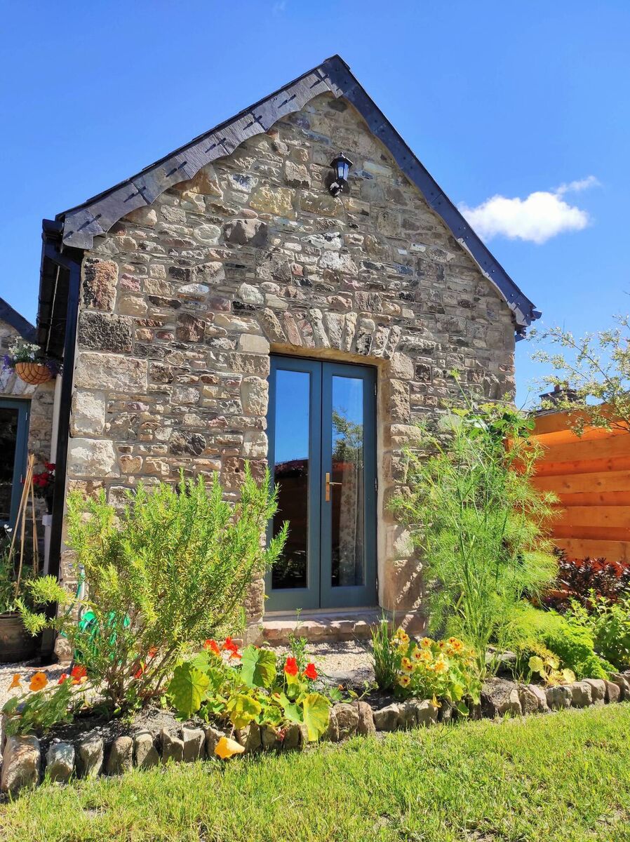 Main bedroom opens to charming south-aspected back garden