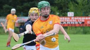 <p>HOOKED: Éire Og's John Mullins attempts to clear upfield under pressure from Watergrasshill's Sean Desmond. </p>