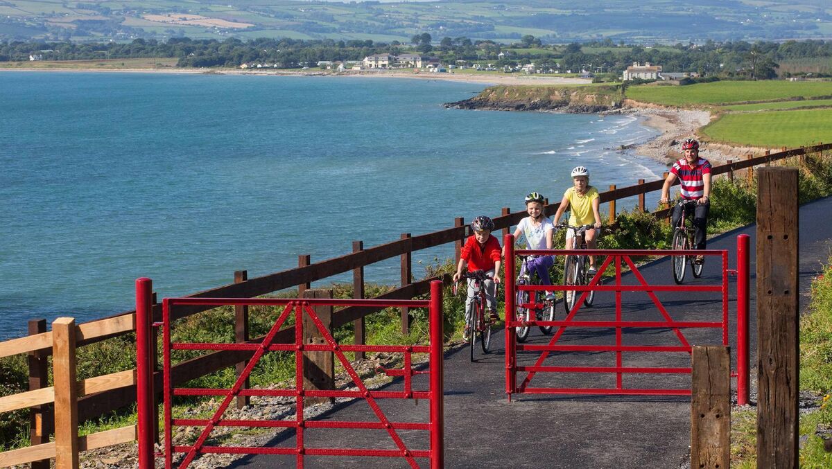 A family enjoys the scenery near Clonea, Dungarvan, on the Waterford Greenway which stretches from Waterford City all the way down to Dungarvan