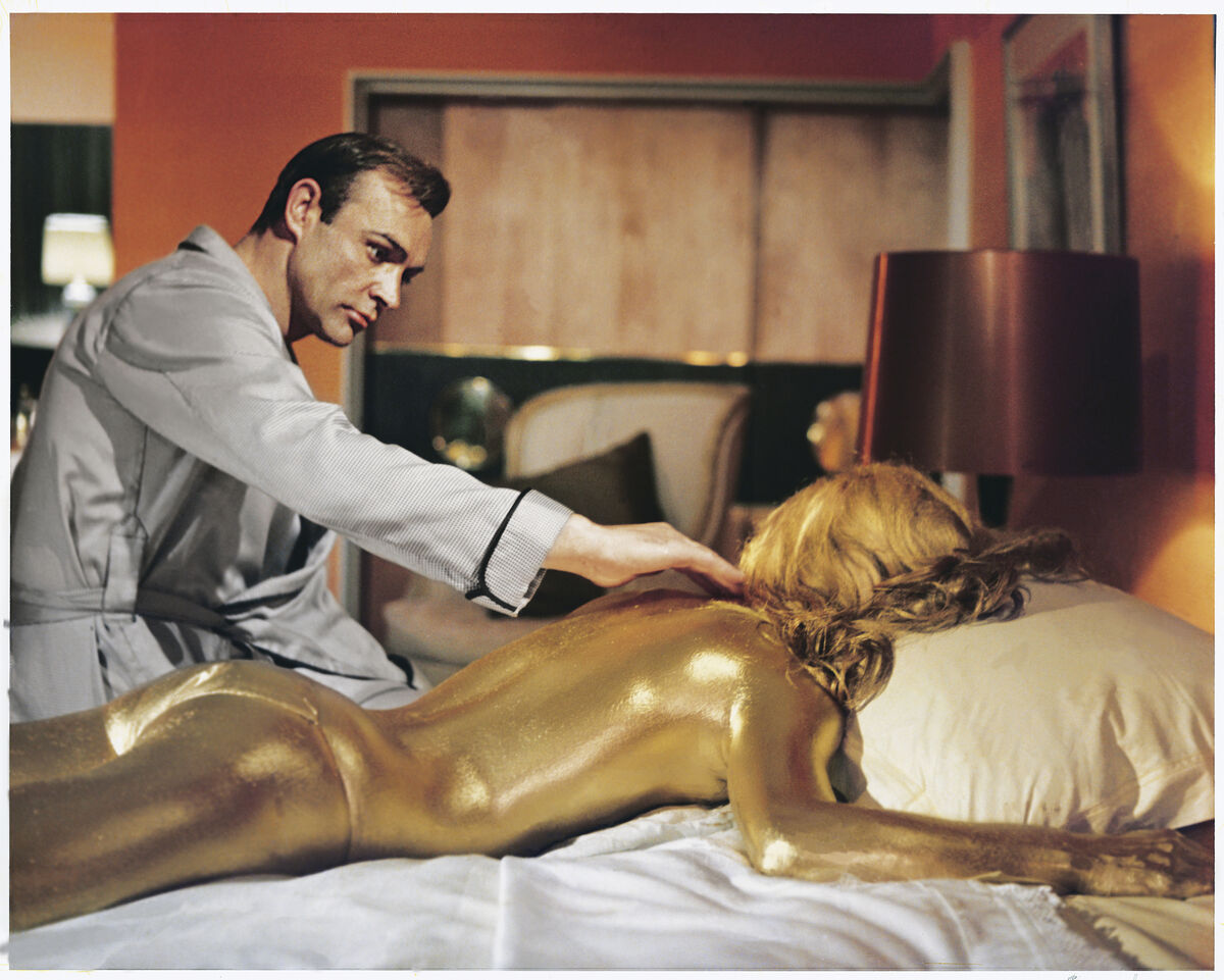 Sean Connery as James Bond in a Goldfinger poster (1964). © 1964 Danjaq, LLC and Metro-Goldwyn-Mayer Studios Inc.