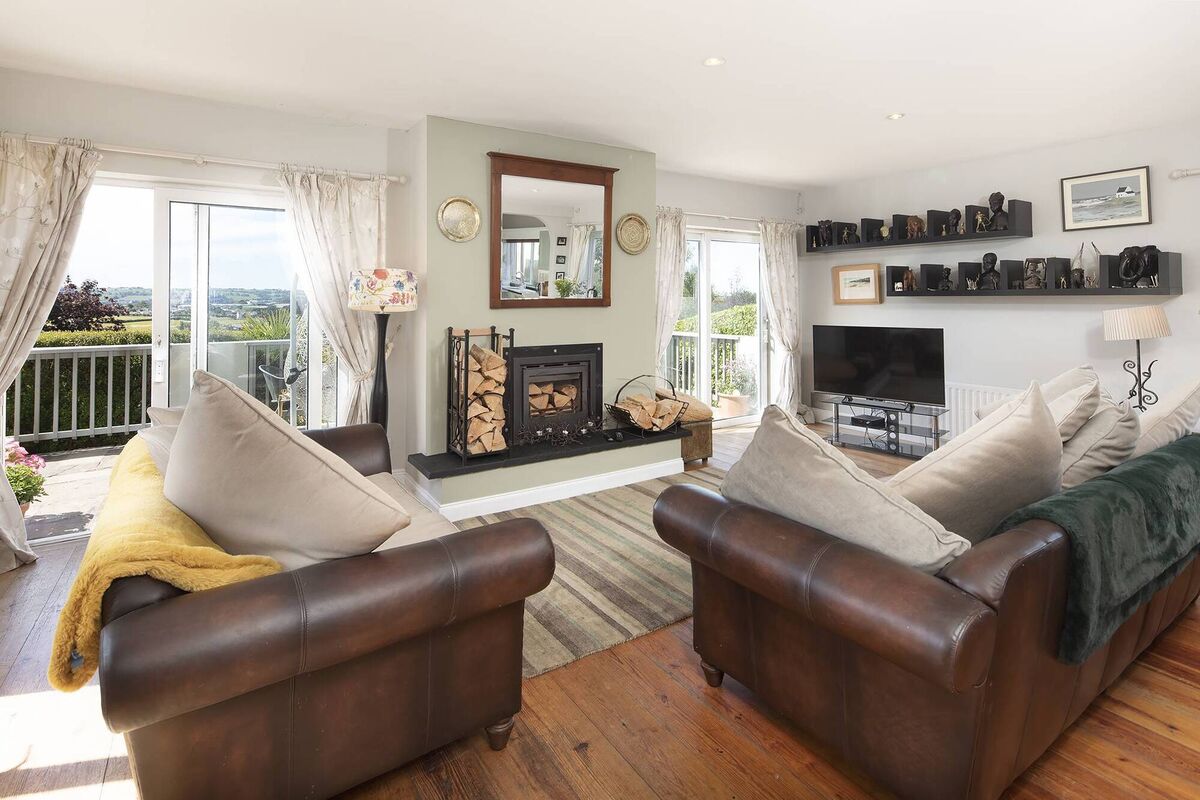 Downstairs sitting room opens onto decking Downstairs sitting room opens onto decking