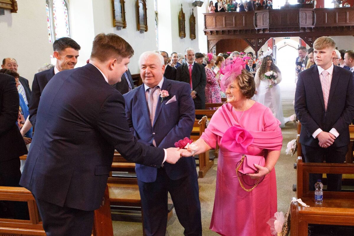 Eileen and Humphrey O'Riordan walk Annmarie O'Riordan up the aisle to Anthony Holmes. Pictures: Healy & Rimmington Photography Eileen and Humphrey O'Riordan walk Annmarie O'Riordan up the aisle to Anthony Holmes. Pictures: Healy & Rimmington Photography