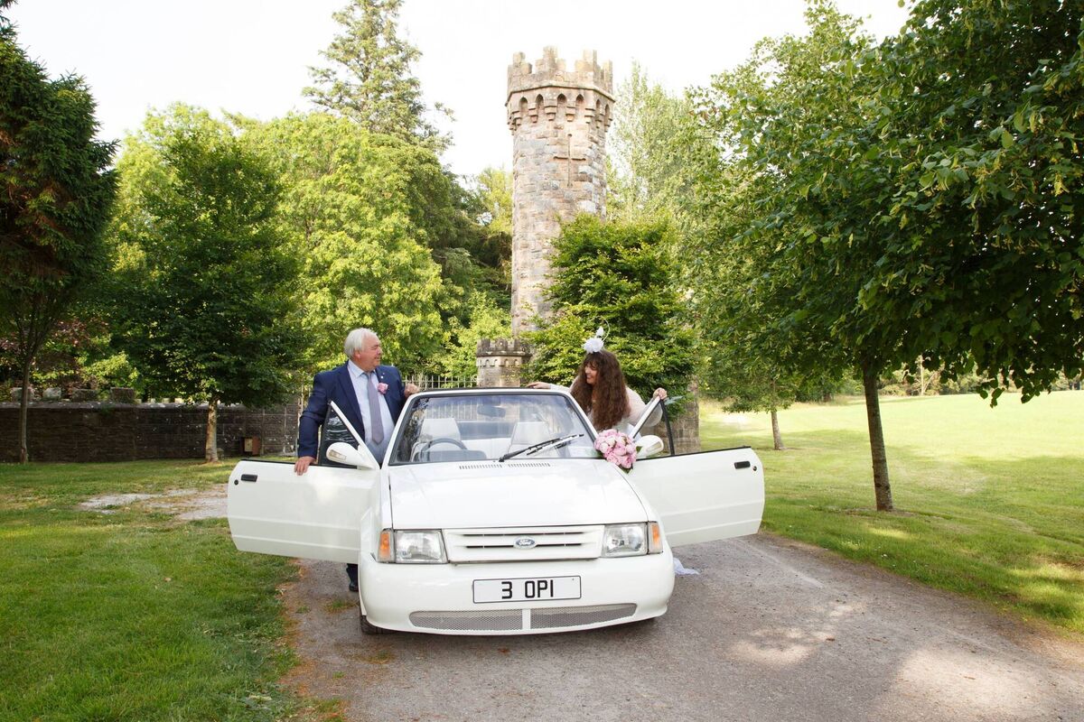 Annmarie O'Riordan and her dad Humphrey O'Riordan leaving for the church in his Ford Escort. Pictures: Healy & Rimmington Photography Annmarie O'Riordan and her dad Humphrey O'Riordan leaving for the church in his Ford Escort. Pictures: Healy & Rimmington Photography