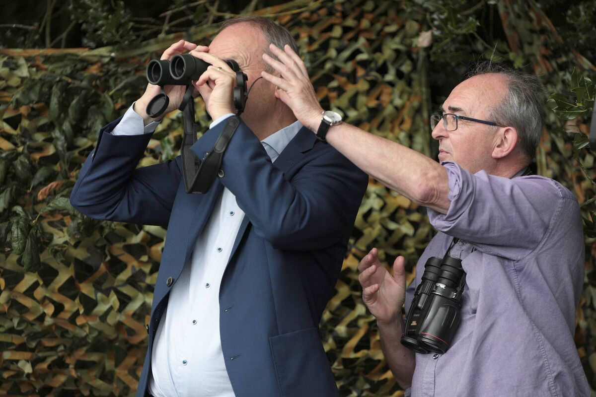 Taoiseach Micheál Martin and divisional manager of the National Parks and Wildlife Service Philip Buckley at the release site of the white-tailed eagles in Tarbert Estuary, Co Kerry. Picture: Valerie O'Sullivan