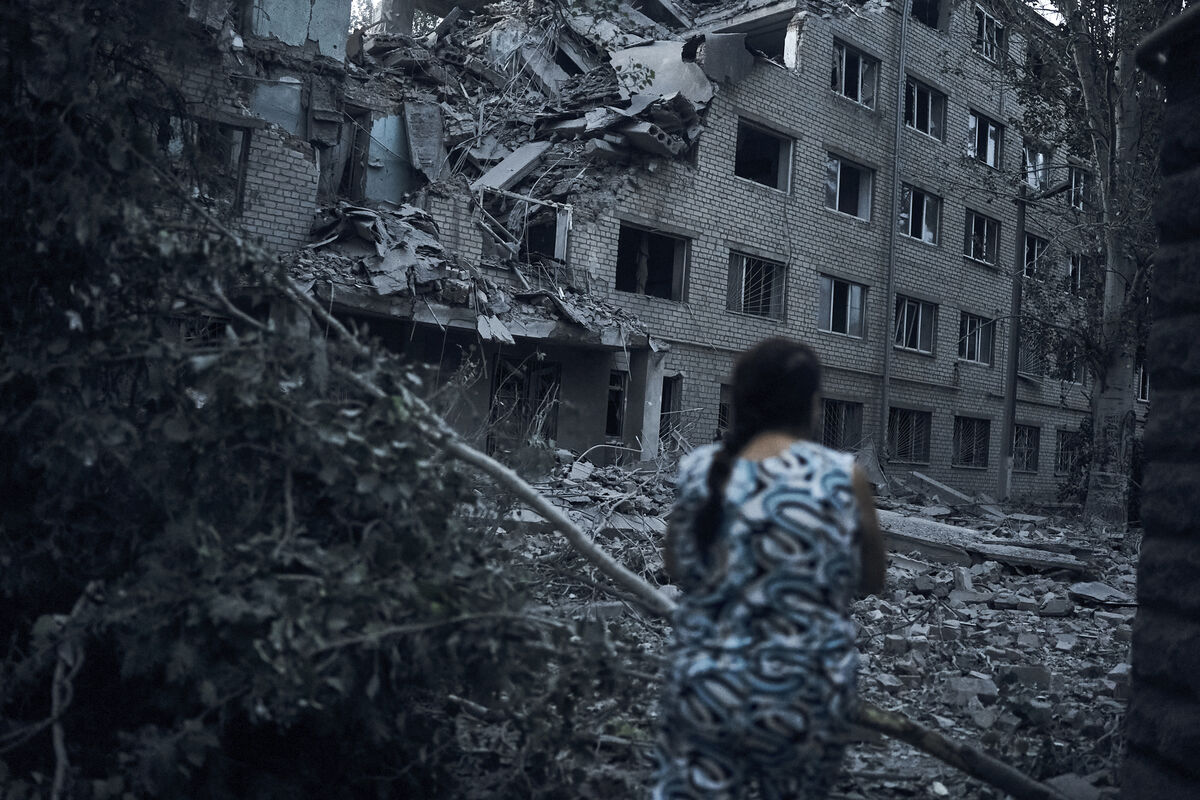 A Ukrainian woman walks amid the debris of a residential building following night shelling in Mykolaiv, Ukraine. Picture: AP Photo/Kostiantyn Liberov A Ukrainian woman walks amid the debris of a residential building following night shelling in Mykolaiv, Ukraine. Picture: AP Photo/Kostiantyn Liberov